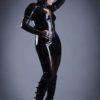 Translucent black latex leggings, teamed with a short jacket and mini skirt.